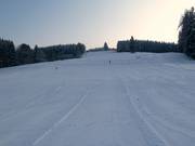 La large piste convient très bien aux débutants.