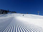 Préparation des pistes de première classe à St. Johann in Tirol