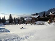 Piste de luge gratuite à Villars avec son propre tapis roulant