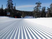 Préparation des pistes de première classe dans le domaine skiable de Kläppen