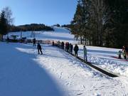 Tapis magique sur la pente d'entraînement