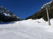 Large et facile piste Valbonetta dans le secteur Ces