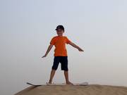 En haut de la dune de sable