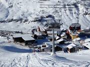 Übungshangbahn - 6 places | Télésiège rapide (débrayable) avec capots de protection et sièges chauffants