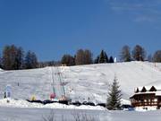Vue sur la piste pour enfants au Monte Pana