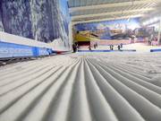 Préparation parfaite des pistes dans la halle de ski The Snow Centre
