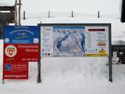 Panneau d'information dans le domaine skiable