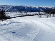 Préparation des pistes de première classe dans le domaine skiable de Geilo